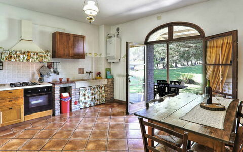Villa Le Selvole: Cabinetry, Furniture, Property, Countertop, Table, Window, Kitchen, Chair, Wood, Interior Design