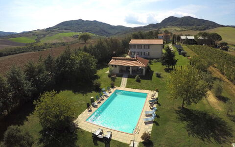 Villa Le Selvole: Water, Sky, Water Resources, Cloud, Mountain, Building, Swimming Pool, Tree, Plant, Land Lot