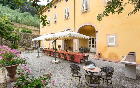 Villa Cantignano: Plant, Building, Flower, Window, Flowerpot, Tree, Table, Outdoor Furniture, Road Surface, Architecture