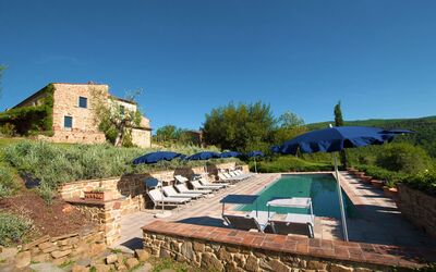 Villa Badia: Plant, Sky, Plant Community, Azure, Land Lot, Tree, Shade, Table, Outdoor Furniture, Grass