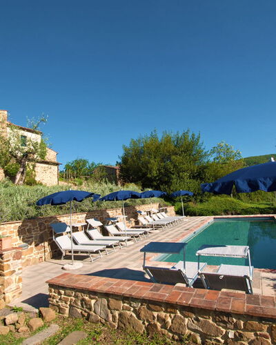 Villa Badia: Plant, Sky, Plant Community, Azure, Land Lot, Tree, Shade, Table, Outdoor Furniture, Grass