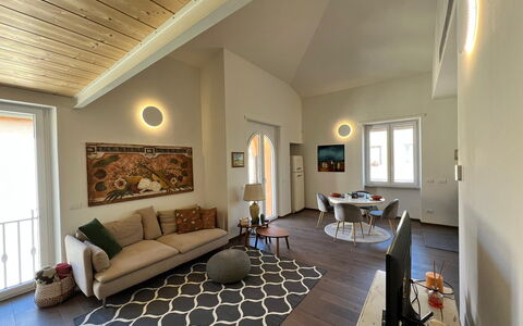 Sui Tetti Di Lucca: Couch, Picture Frame, Furniture, Table, Wood, Building, Living Room, Interior Design, Studio Couch, Hall