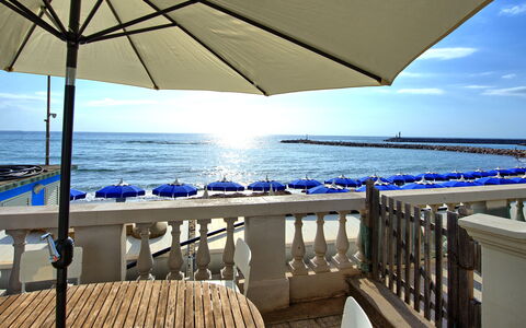 Casa Riva: Water, Sky, Property, Light, Blue, Azure, Building, Shade, Umbrella, Seaside Resort