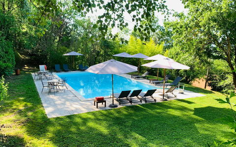 Borgo Al Castello: Plant, Property, Umbrella, Shade, Tree, Outdoor Furniture, Botany, Land Lot, Chair, Sky