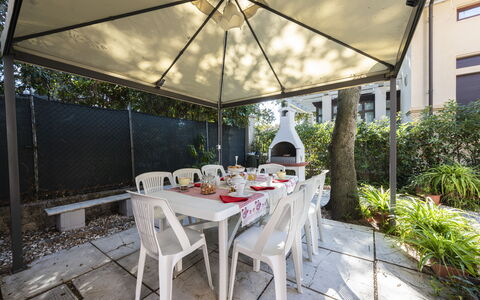 Villa Marconi: Table, Plant, Furniture, Building, Chair, Shade, Outdoor Furniture, Interior Design, Outdoor Table, Tableware