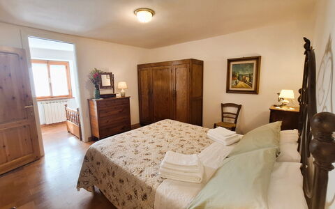 Villa Renaccio: Furniture, Bed, Bedroom, Interior Design, Bed Sheet, Flooring, Wood, Bedding, Floor, Room