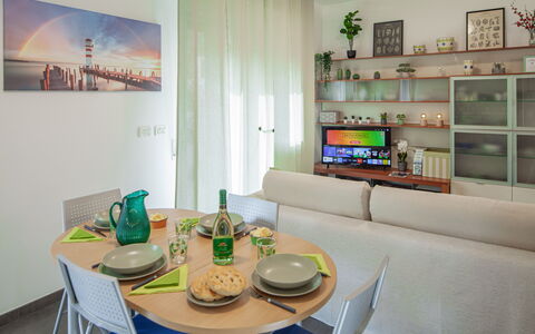 Apartment Serena - Levanto: Table, Furniture, Property, Couch, Azure, Interior Design, Shelf, Architecture, Picture Frame, Tableware