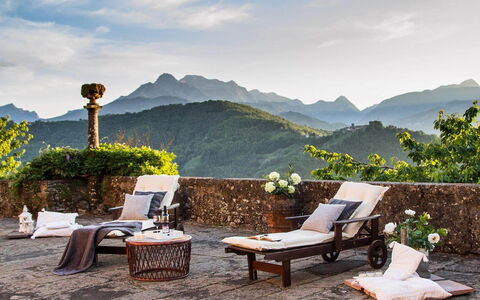 Villa In Garfagnana: Sky, Cloud, Plant, Property, Furniture, Flower, Table, Mountain, Nature, Outdoor Furniture