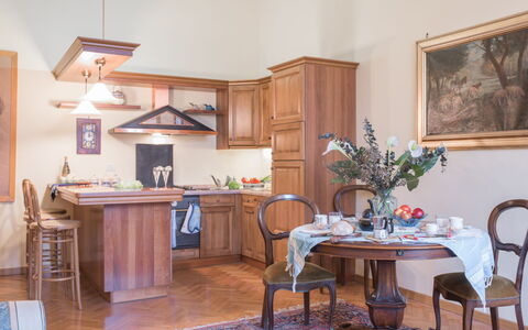 Duomo Suite: Furniture, Table, Cabinetry, Flower, Chair, Wood, Countertop, Picture Frame, Flooring, Building