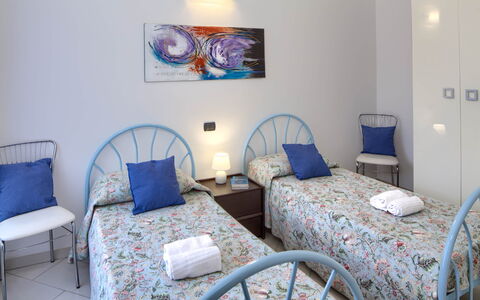 Apartment Fernanda 2 - Levanto: Table, Furniture, Property, Azure, Blue, Comfort, Textile, Interior Design, Chair, Lighting