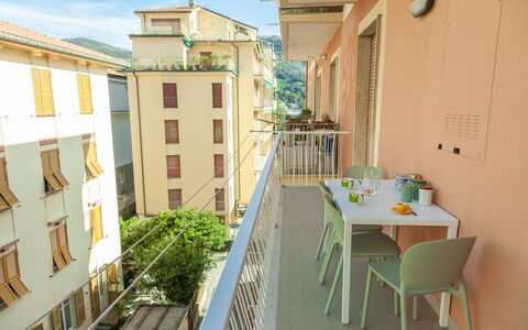 Apartment Fernanda 2 - Levanto: Building, Table, Window, Furniture, Sky, Chair, Yellow, Neighbourhood, House, Plant