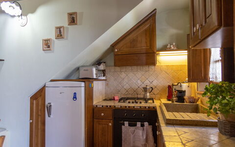 Villa Dei Ciliegi: Countertop, Cabinetry, Property, Plant, Kitchen, Kitchen Stove, Wood, Gas Stove, Flowerpot, Interior Design