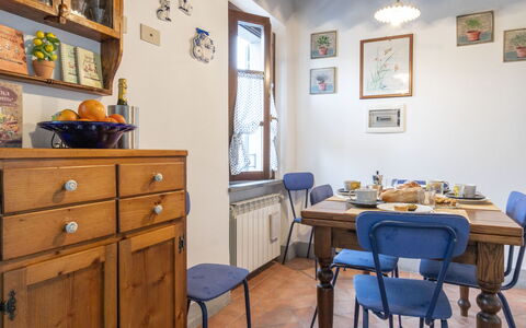 Il Borgo Apartment: Picture Frame, Furniture, Table, Property, Cabinetry, Azure, Blue, Chair, Drawer, Dresser