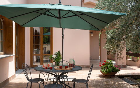 Villa Morellino: Table, Plant, Furniture, Property, Building, Chair, Shade, Flowerpot, Outdoor Furniture, Outdoor Table