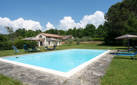Villa Le Selve: Cloud, Water, Sky, Plant, Property, Swimming Pool, Shade, Tree, Building, Grass