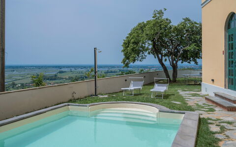 Massarosa Front Lake, The Gargoyles: Water, Plant, Property, Daytime, Sky, Blue, Azure, Swimming Pool, Tree, Architecture