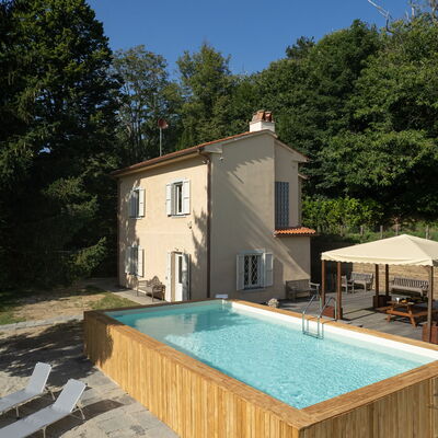 Casa Serra: Plant, Property, Building, Window, Swimming Pool, Sky, Tree, Chair, Outdoor Furniture, Wood