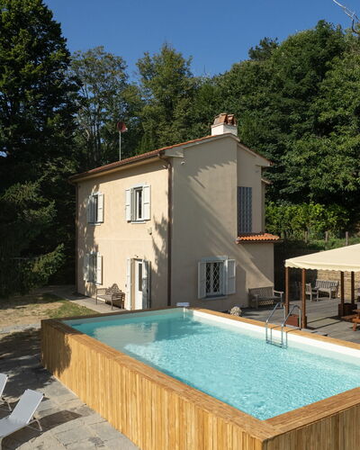Casa Serra: Plant, Property, Building, Window, Swimming Pool, Sky, Tree, Chair, Outdoor Furniture, Wood