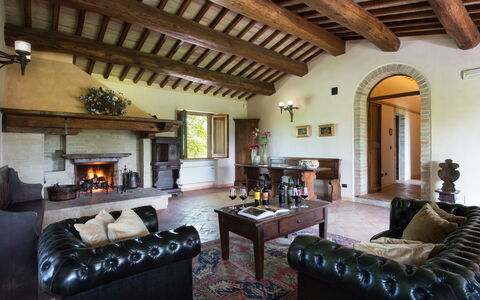 Villa Assisi: Couch, Property, Furniture, Picture Frame, Interior Design, Wood, Living Room, Floor, Houseplant, Table