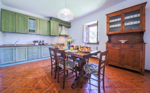 Villa Niccone: Furniture, Table, Cabinetry, Wood, Chair, Lighting, Interior Design, Countertop, Kitchen, Flooring