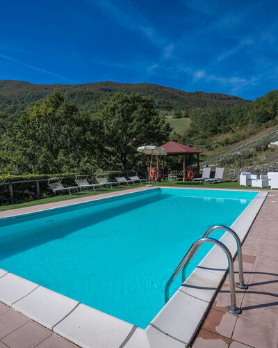 La Vecchia Fornace La Piastra Apartments - Abetone: Water, Sky, Building, Plant, Cloud, Swimming Pool, Azure, Rectangle, Tree, House