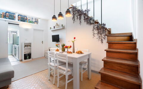 Lucca Old Town Apartment - Lucca, Toscana: Furniture, Table, Building, Plant, Living Room, Orange, Houseplant, Interior Design, House, Wood