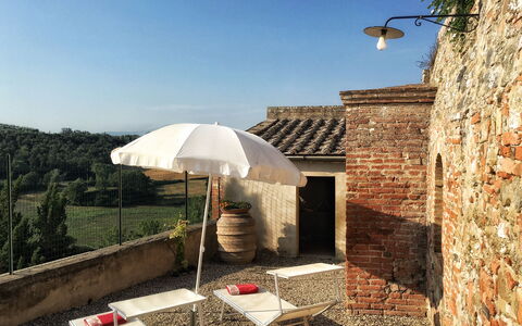 Casa Le Crete: Sky, Property, Building, Umbrella, Shade, Biome, Street Light, Outdoor Furniture, Tree