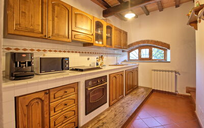 Loggiato: Cabinetry, Property, Countertop, Wood, Kitchen, Kitchen Appliance, Kitchen Stove, Interior Design, Wood Stain, Flooring