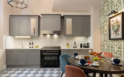 Pazzi Penthouse Luxury Apartment in Florence by Pa: Furniture, Cabinetry, Property, Countertop, Table, Sink, Interior Design, Wood, Chair, Flooring