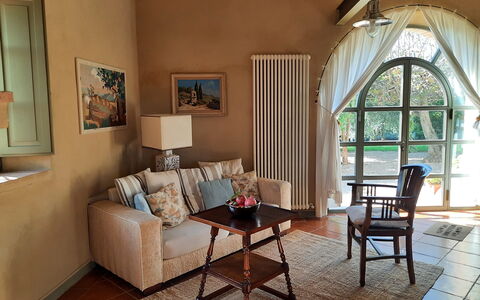 Villa San Giovanni: Furniture, Property, Table, Picture Frame, Couch, Wood, Comfort, Interior Design, Lighting, Living Room