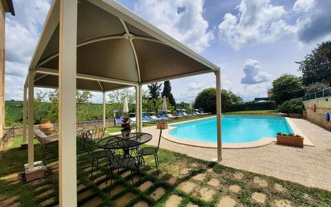 Villa Delle Palme: Sky, Cloud, Water, Plant, Swimming Pool, Shade, Outdoor Furniture, Umbrella, Tree, Building