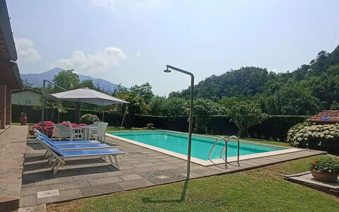 Villa Carducci: Sky, Water, Plant, Property, Cloud, Swimming Pool, Shade, Outdoor Furniture, Tree, Rectangle