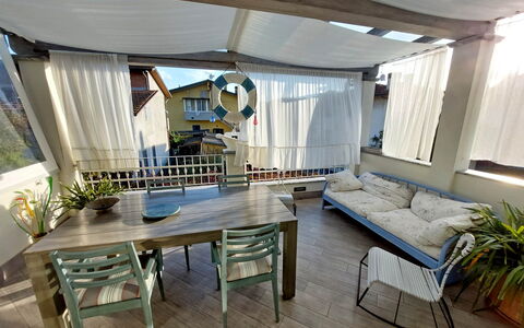 Appartamento Mare Azzurro: Table, Furniture, Plant, Couch, Azure, Houseplant, Shade, Wood, Living Room, Floor