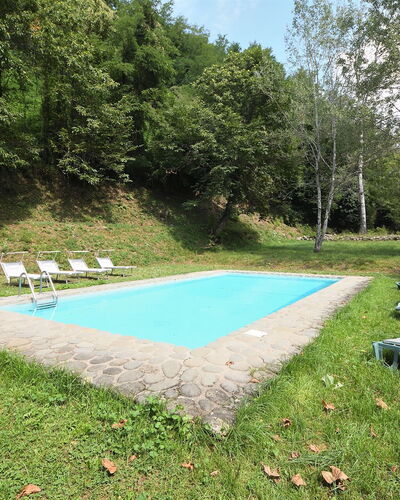 Villa Del Mulino: Plant, Shade, Land Lot, Sky, Grass, Groundcover, Swimming Pool, Leisure, Outdoor Furniture, Tree