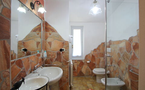 Casa Luigi: Mirror, Tap, Sink, Bathroom Sink, Plumbing Fixture, Bathroom, Wood, Interior Design, Lighting, Building