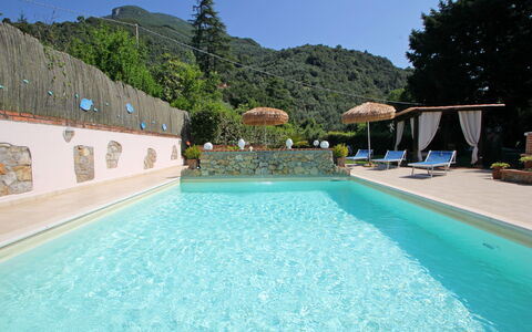 Casa Luigi: Water, Sky, Plant, Property, Swimming Pool, Azure, Nature, Building, Tree, Leisure