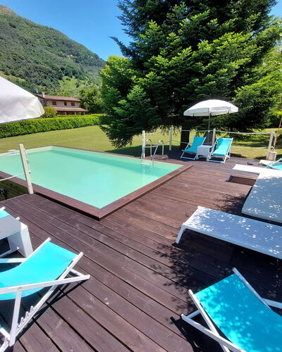 Villa L'antico Casale: Property, Furniture, Water, Umbrella, Swimming Pool, Sky, Green, Blue, Azure, Shade