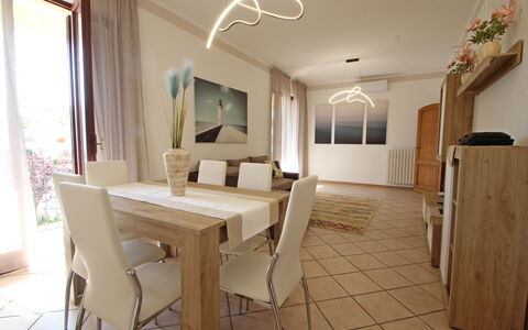 Appartamento Levante: Table, Furniture, Property, Window, Wood, Chair, Lighting, Interior Design, Floor