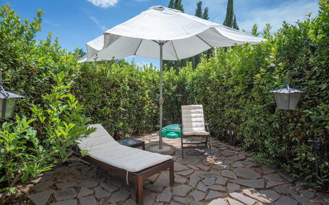 Torri 15 Holiday Home: Plant, Sky, Furniture, Property, Cloud, Botany, Shade, Outdoor Furniture, Umbrella, Grass