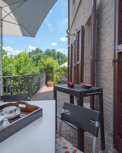 Torri 15 Holiday Home: Sky, Building, Property, Table, Furniture, Cloud, Tableware, Window, Architecture, Flowerpot