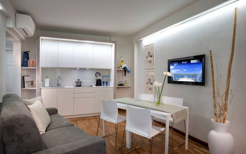 Butterfly With Beach & Breakfast Included: Table, Furniture, Couch, Picture Frame, Building, Houseplant, Interior Design, Floor, Shelf, Flooring