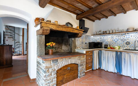 Villa Chicco: Building, Hearth, Wood, Interior Design, Living Room, Flooring, Floor, Beam, Brick, Wood Stain