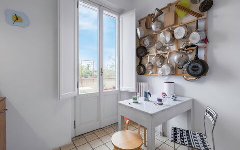 Orto Botanico Apartment With Terrace And Dome View: Table, Property, Furniture, Window, Interior Design, Wood, Lighting, Floor, Shelving