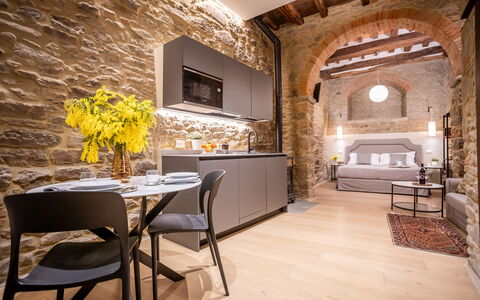 Maccari Suite: Interior Design, Furniture, Ceiling, Living Room, Apartment, Stone Wall, Couch, Chair, Light Fixture