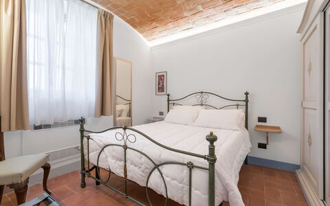 Le Volte, Borgo Campassini, Monteriggioni: Bed, Wall, Interior Design, Furniture, Bedroom, Ceiling, Room, Floor, Bedding, Bed Frame