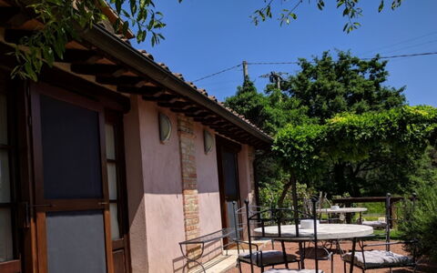 Podere della Bruciata: Door, Shade, Cottage, Chair, Balcony, Outdoor Furniture, Outdoor Table, Backyard, Yard, Wood Stain