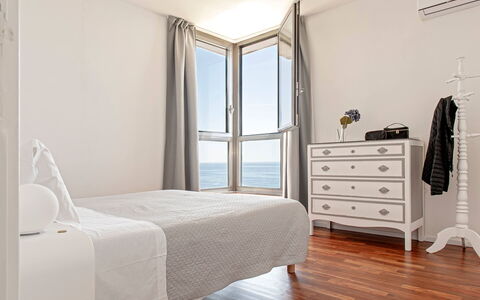 Villa Baia al Mare: Furniture, Interior Design, Wood, Floor, Flooring, Bedroom, Bed, Room, Bed Sheet, Lighting