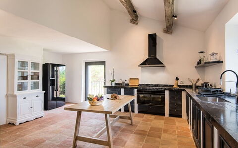 Villa Ugo: Kitchen, Furniture, Countertop, Flooring, Interior Design, Kitchen Appliance, Wood, Cabinetry, Kitchen Stove, Floor