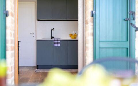 Il Pino Apartment: Wood, Kitchen, Interior Design, Flooring, Countertop, Furniture, Floor, Cabinetry, Home, Kitchen Appliance