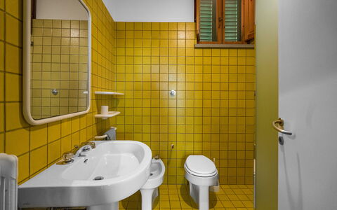 Il Villino Del Collezionista With Pool In Pistoia: Plumbing Fixture, Yellow, Flooring, Bathroom, Plumbing, Floor, Tap, Sink, Tile, Bathroom Sink